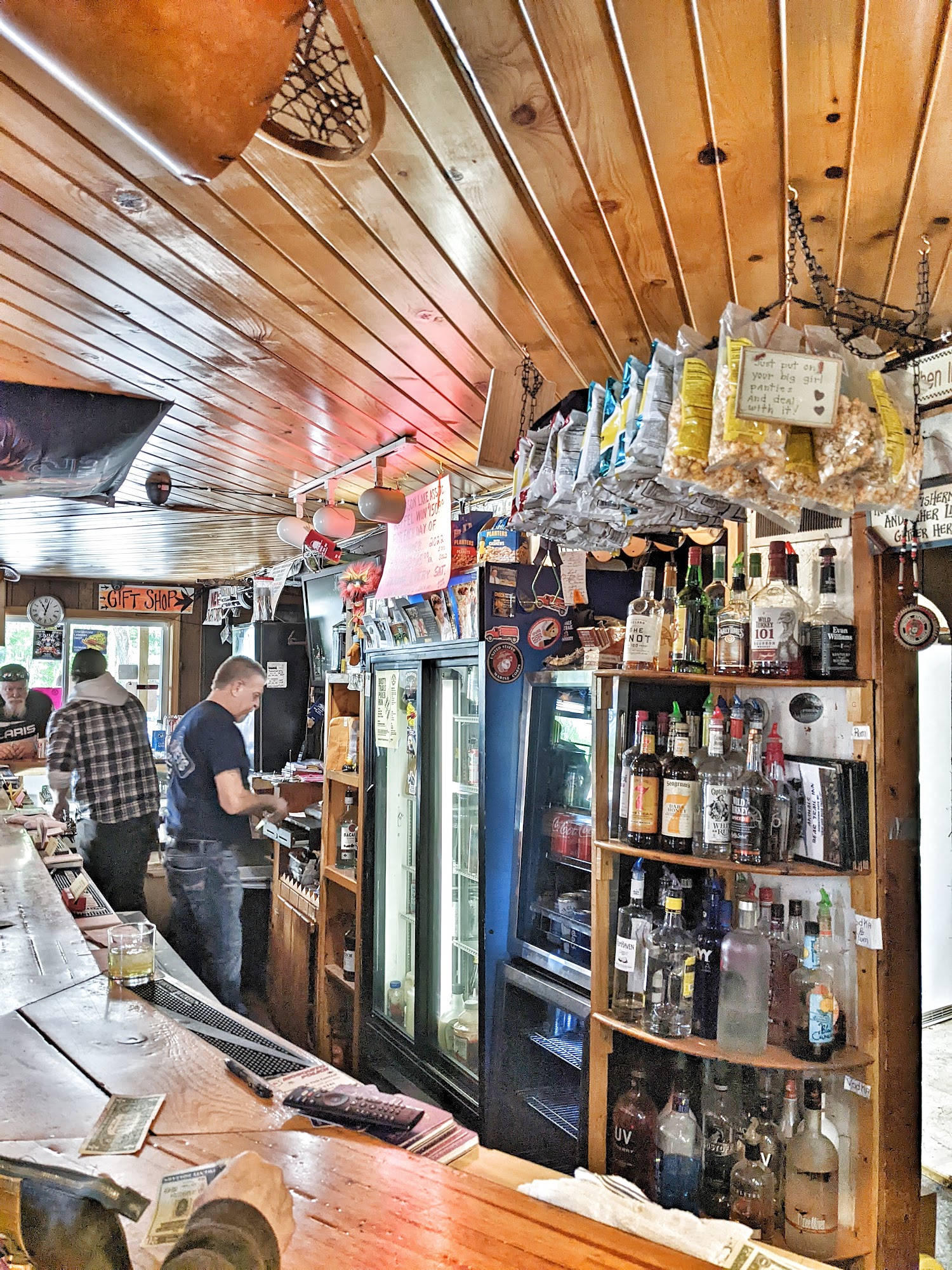 The rustic bar shelves and wood interior
