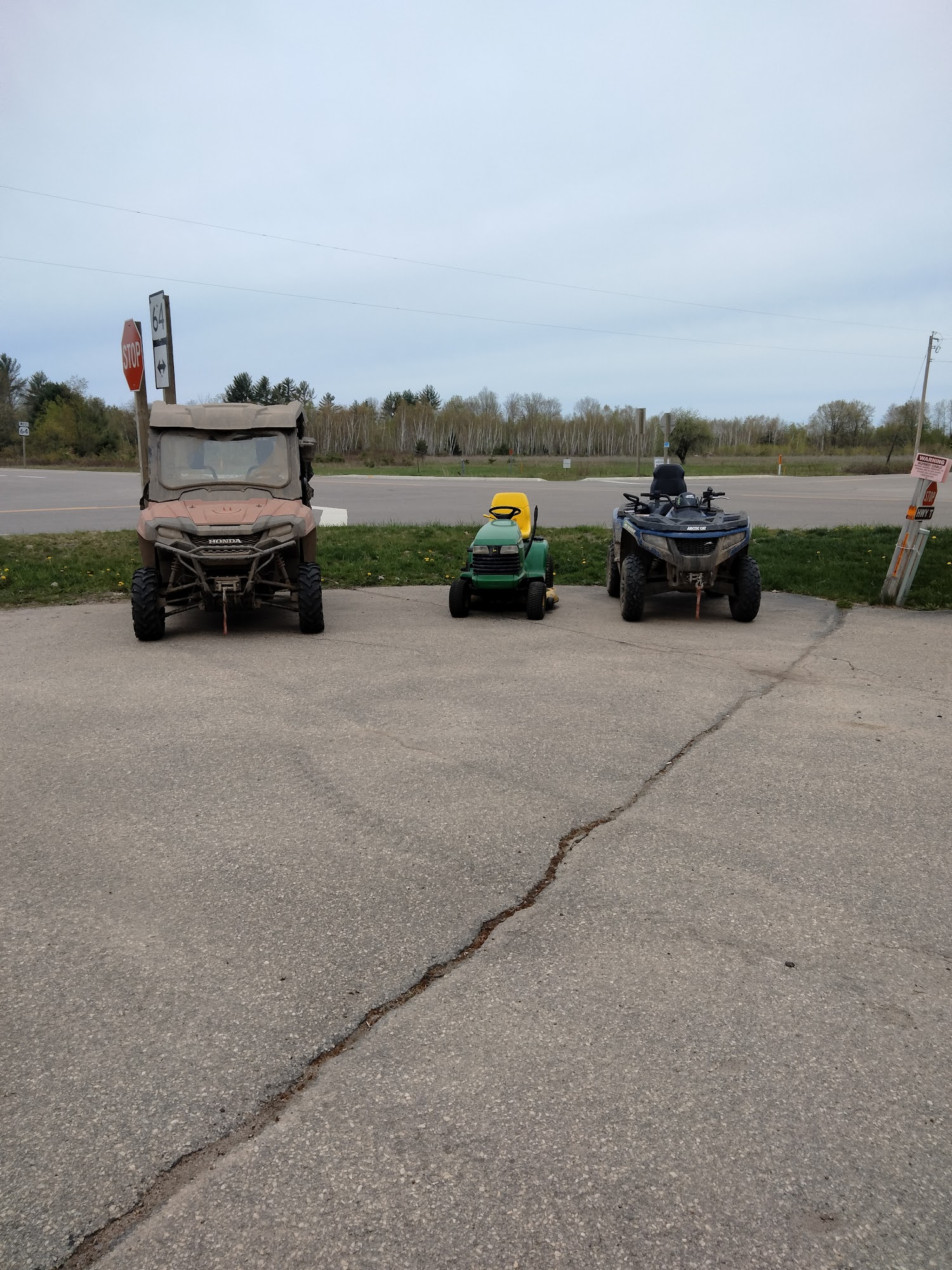 ATVs parked outside near Highway 64